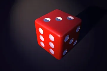 حجر نرد أحمر على خلفية داكنة